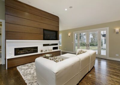 A living room with a fireplace and tv.